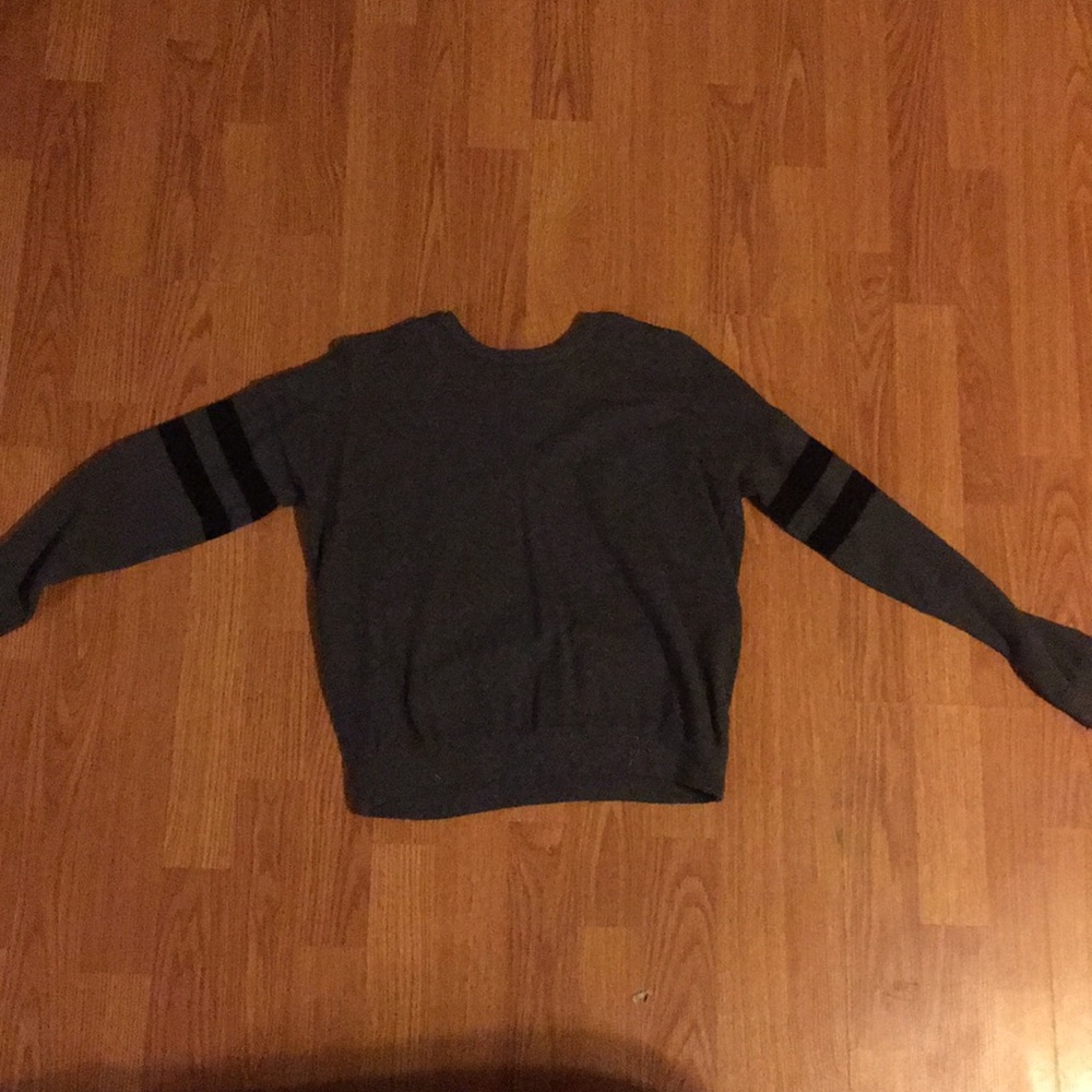 Grey and black long sleeve sweater.